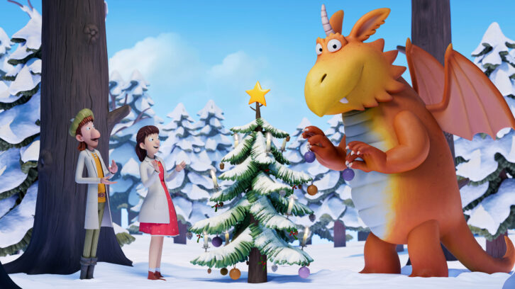 Zog decorates a Christmas Tree ina. snowy forest with a bright yellow star at the top of the treaa