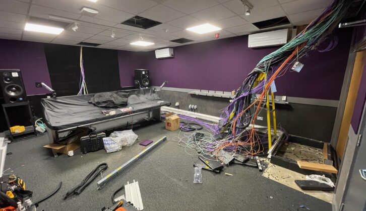 The sound control room begins its upgrade, with wires hanging from the ceiling