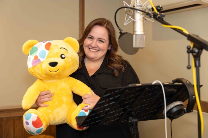 Actress Jessica Gunning poses with a cuddly Pudsey and she records her lines for the film